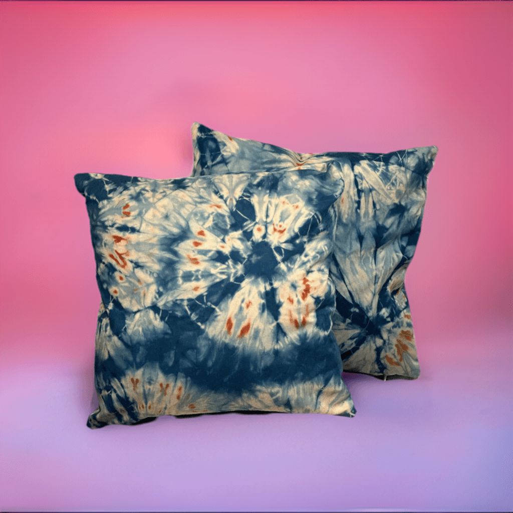 Hand-dyed indigo shibori pillow cases with sand dollar design.