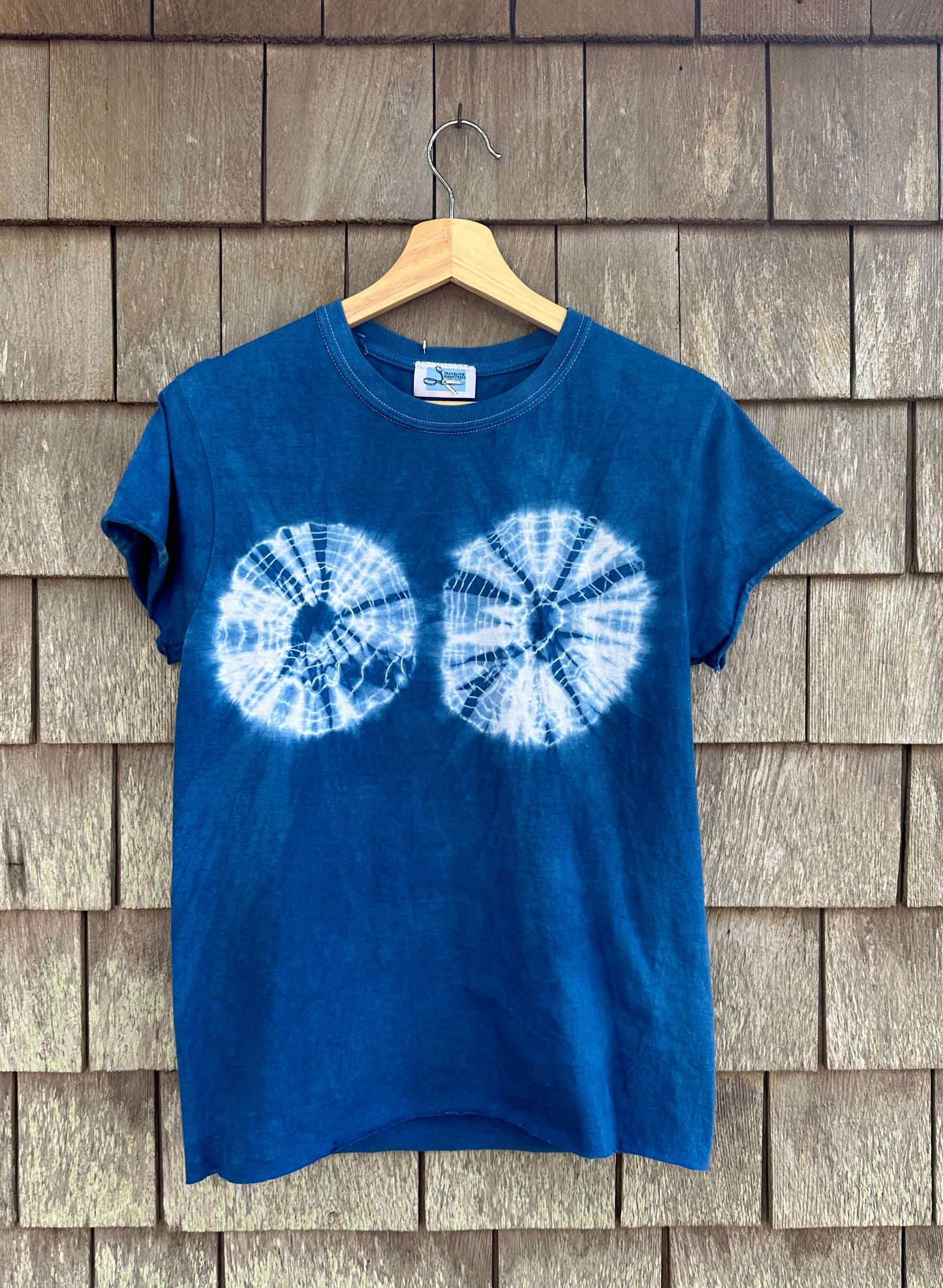 A vibrant tie dye shirt featuring a beautiful indigo and design.